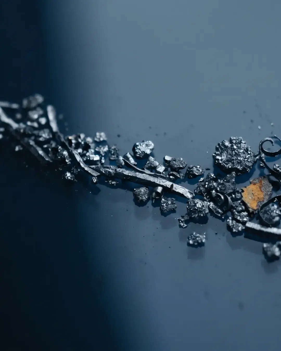 Fine ferrous wear particles strung across a substrate under cold light