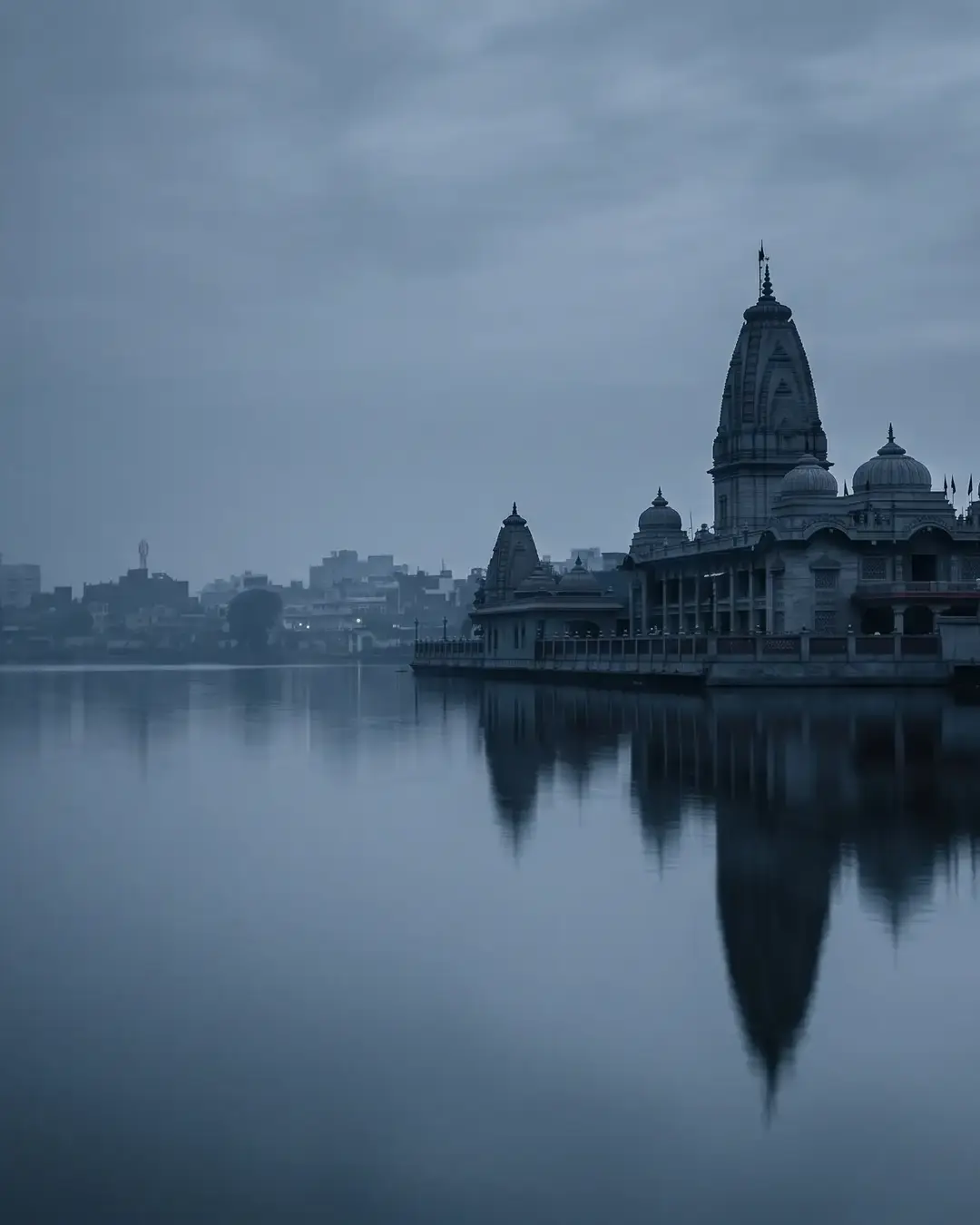 Gorakhpur at blue hour: the temple complex mirrored in the still water of Ramgarh Tal