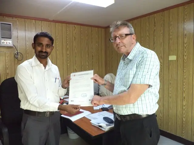 Mr. Senthil of TCR Arabia receiving this appreciation letter from Mr. Keith Baldam (CAT, QC Manager)