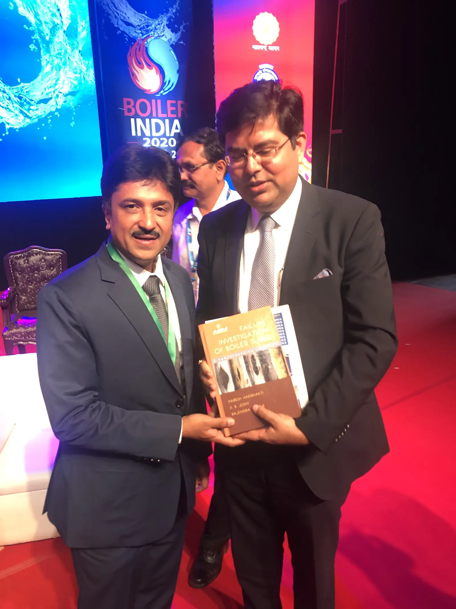 Paresh Haribhakti presenting a copy of the book to a delegate at Boiler India 2020