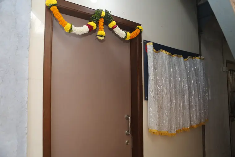 The garlanded door of Room 18 on the second floor of BME House on the opening day of the collection centre