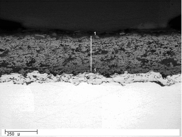 Optical micrograph of a thermal spray coating in cross-section: layer thickness measurement with a 250 micron scale bar
