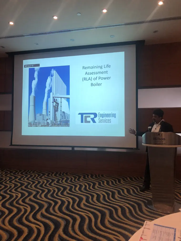Paresh Haribhakti at the lectern beside his opening slide, Remaining Life Assessment (RLA) of Power Boiler, at the KNPC Plant Integrity Solutions Workshop in Kuwait