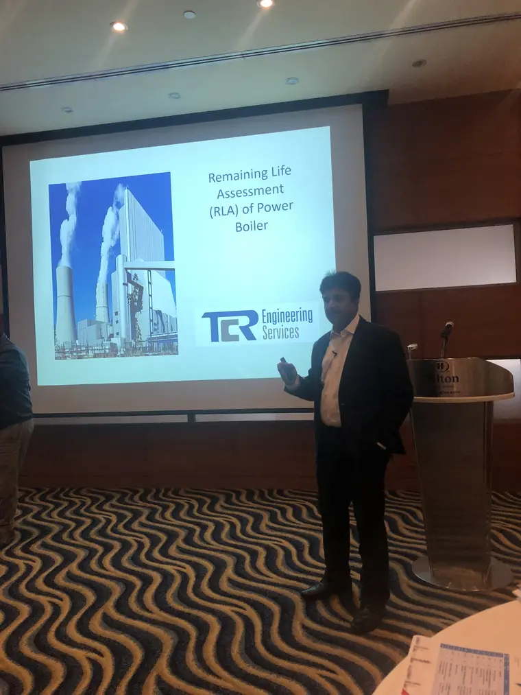 Paresh Haribhakti presenting to the room from the projected TCR title slide on remaining life assessment of power boilers