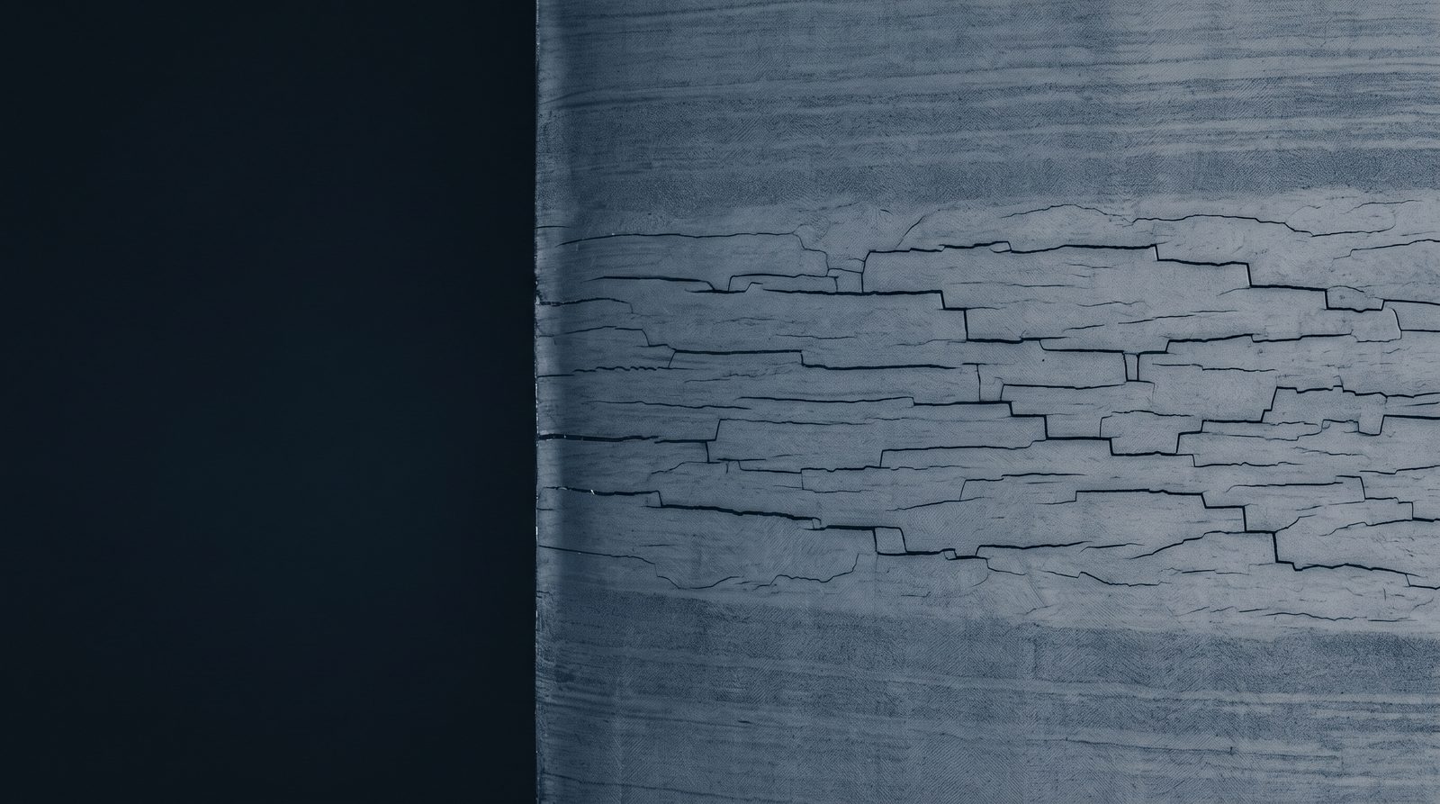 Macro cross-section of steel line pipe plate with stepwise hydrogen-induced cracks running through the mid-thickness
